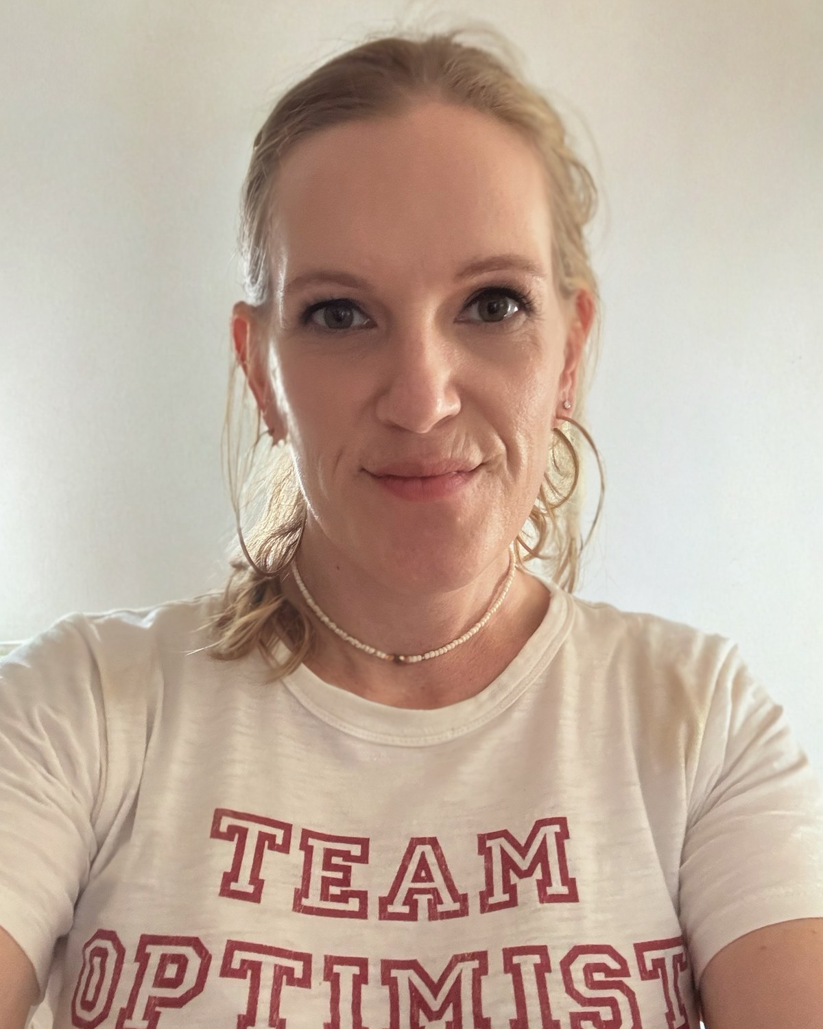 Amy in a Team Optimist T-shirt
